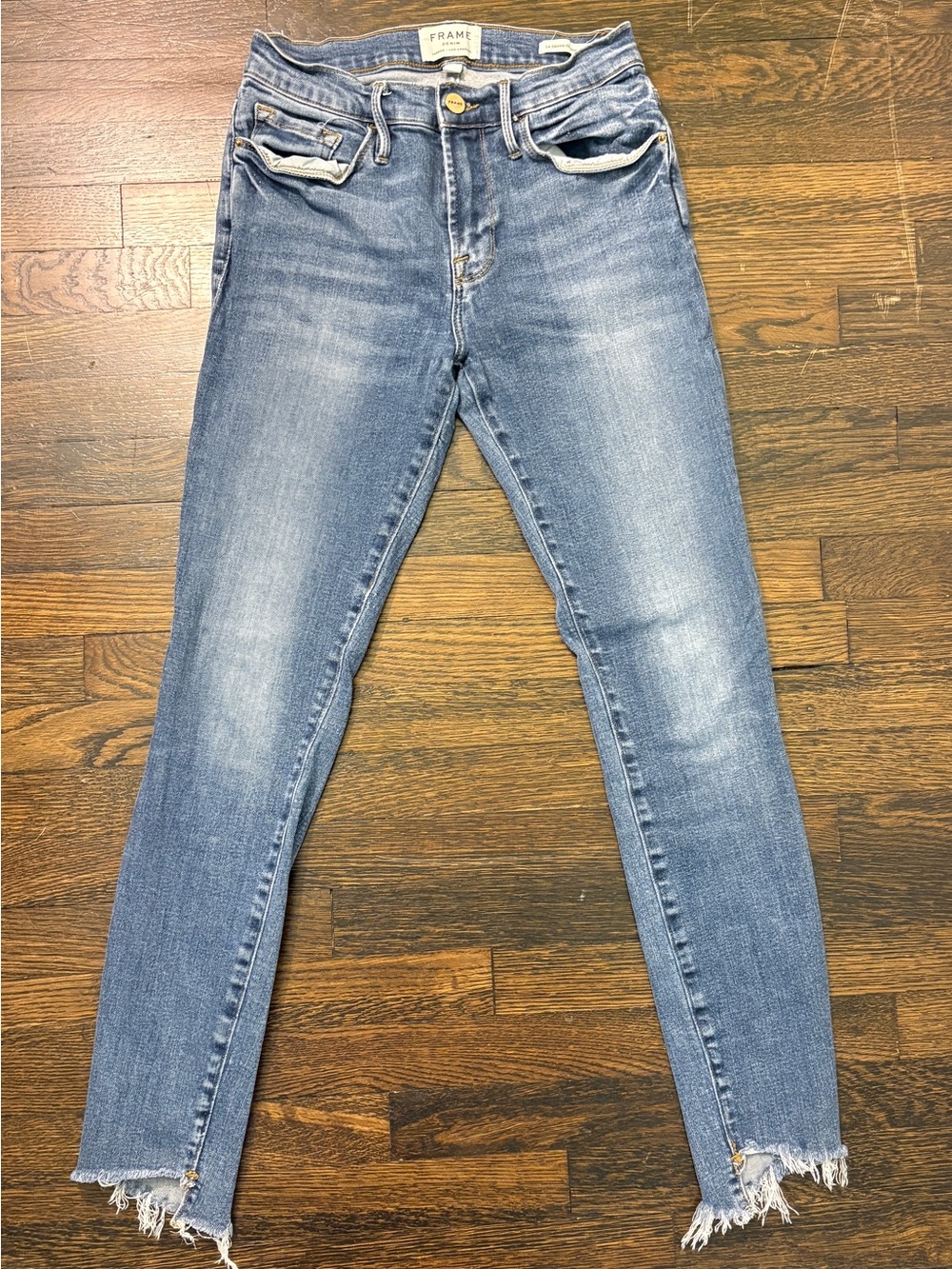 Frame Denim Le High Skinny Jeans in Faded Blue Wash with Frayed Hem